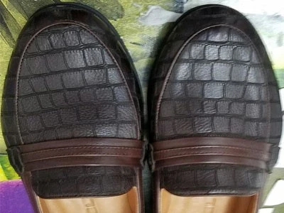 Laser marking in men's leather shoes Laser marking in men's leather shoes